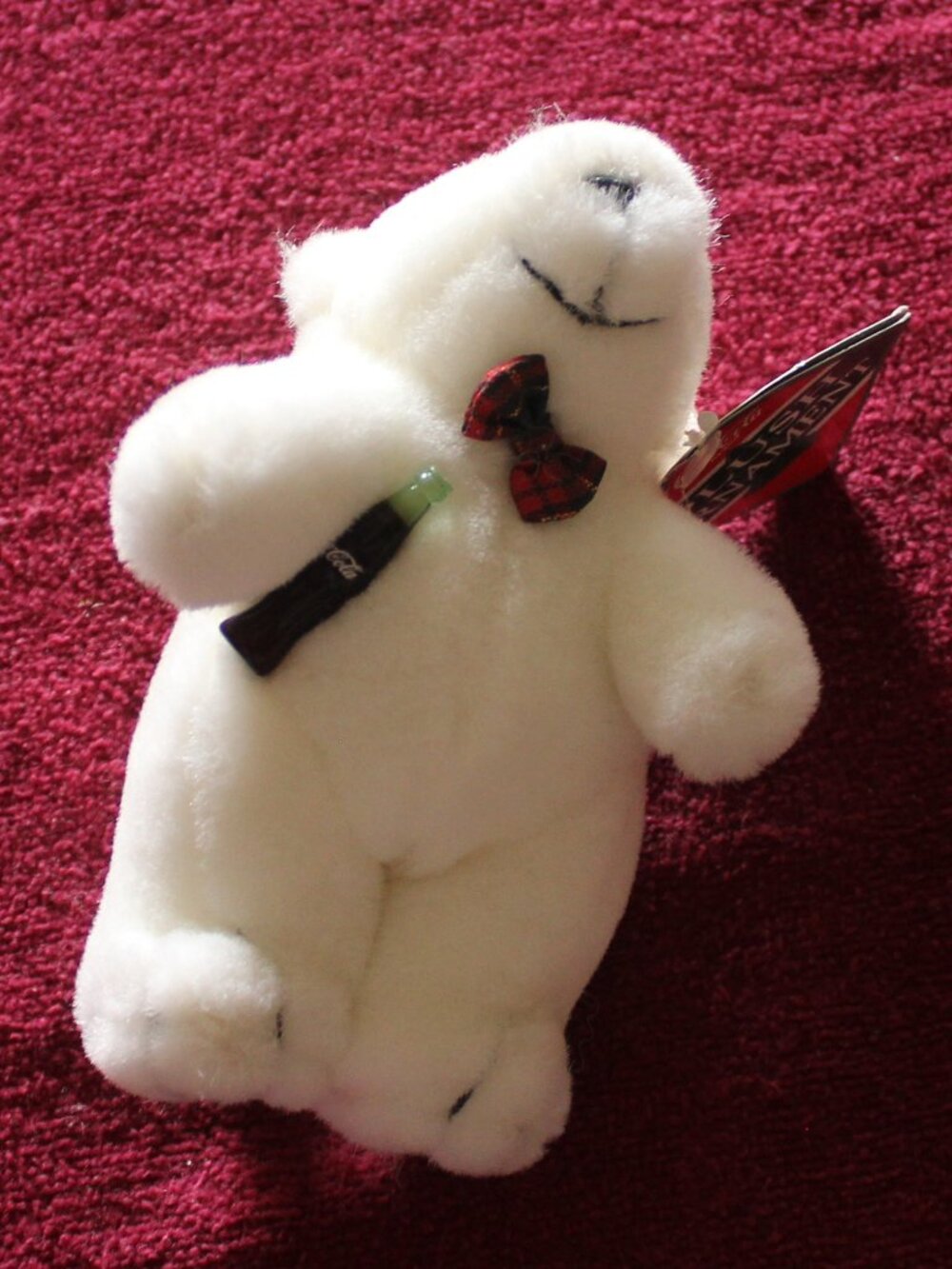 Vintage Coca-Cola plush polar bear ornament, red-and-black patterned bowtie